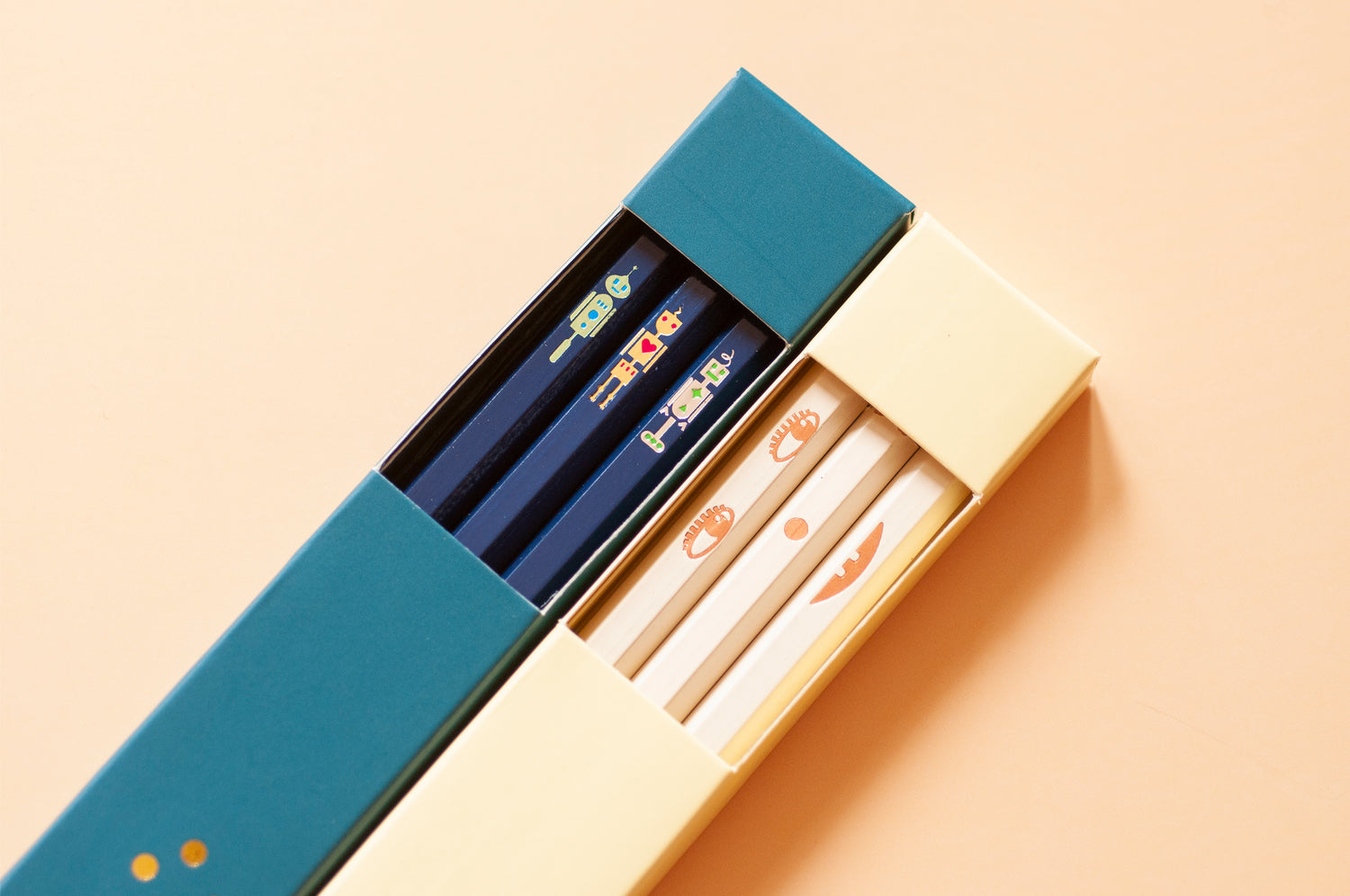 Penchi pencil box packaging window displaying creative visual designs hand-stamped with metallic foils onto wooden hexagonal pencils