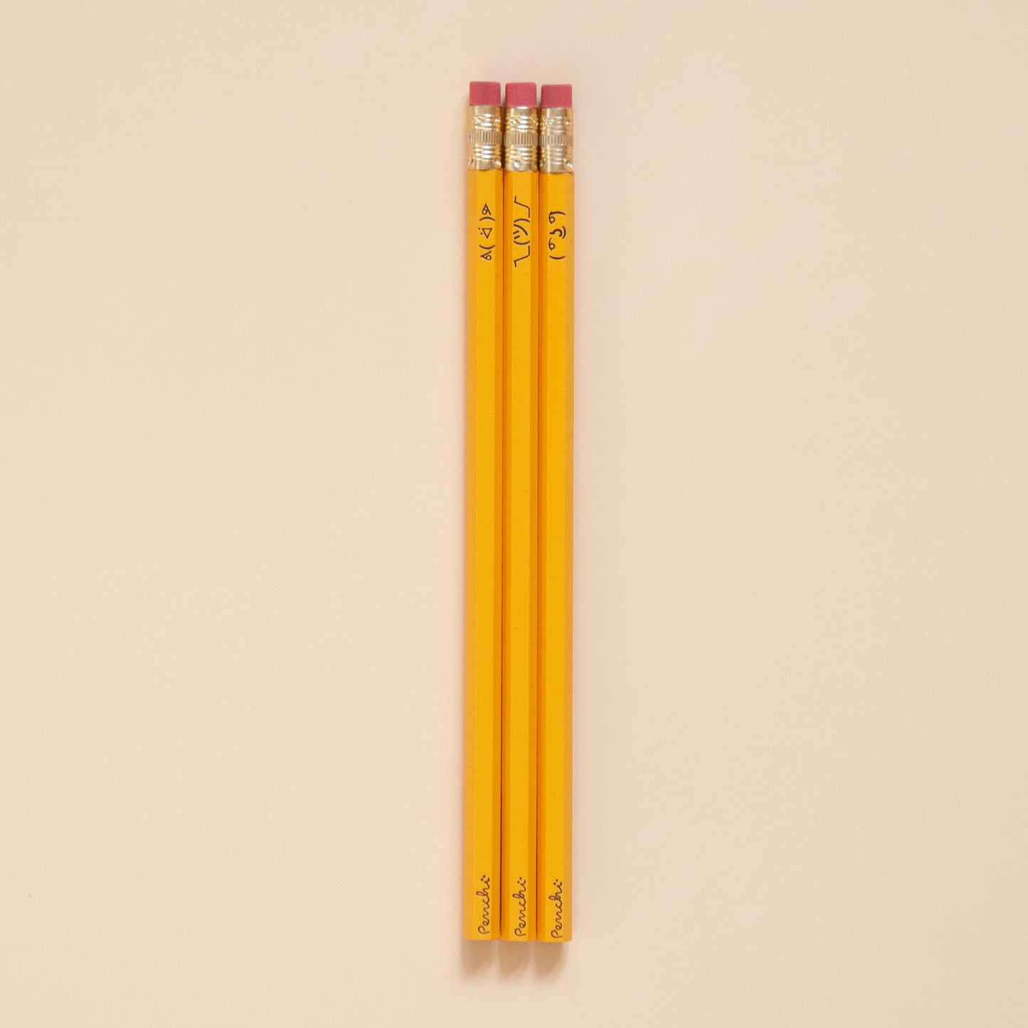 Pencil set with ASCII faces including ( ͡° ͜ʖ ͡°) , ¯\_(ツ)_/¯, and ᕕ( ᐛ )ᕗ , in school yellow color