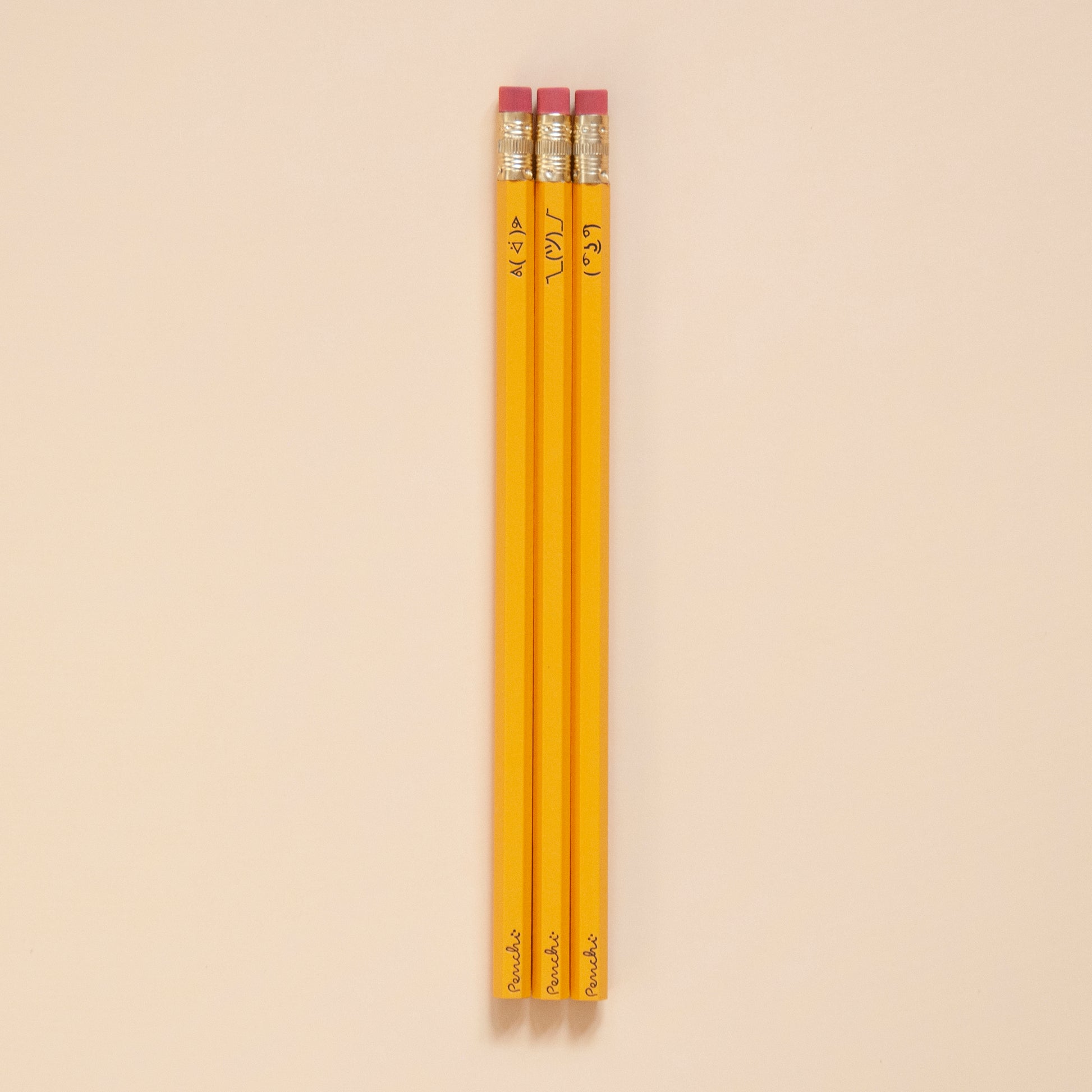 Pencil set with ASCII faces including ( ͡° ͜ʖ ͡°) , ¯\_(ツ)_/¯, and ᕕ( ᐛ )ᕗ , in school yellow color