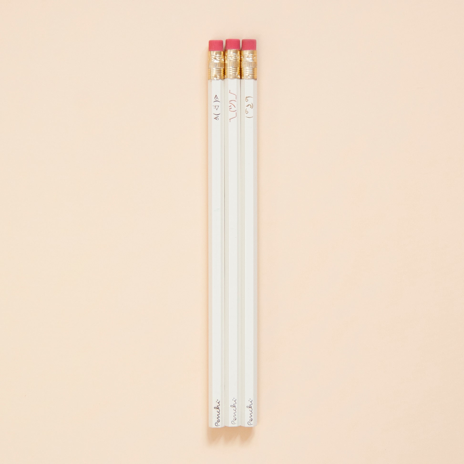 Pencil set with ASCII faces including ( ͡° ͜ʖ ͡°) , ¯\_(ツ)_/¯, and ᕕ( ᐛ )ᕗ , neutral shades