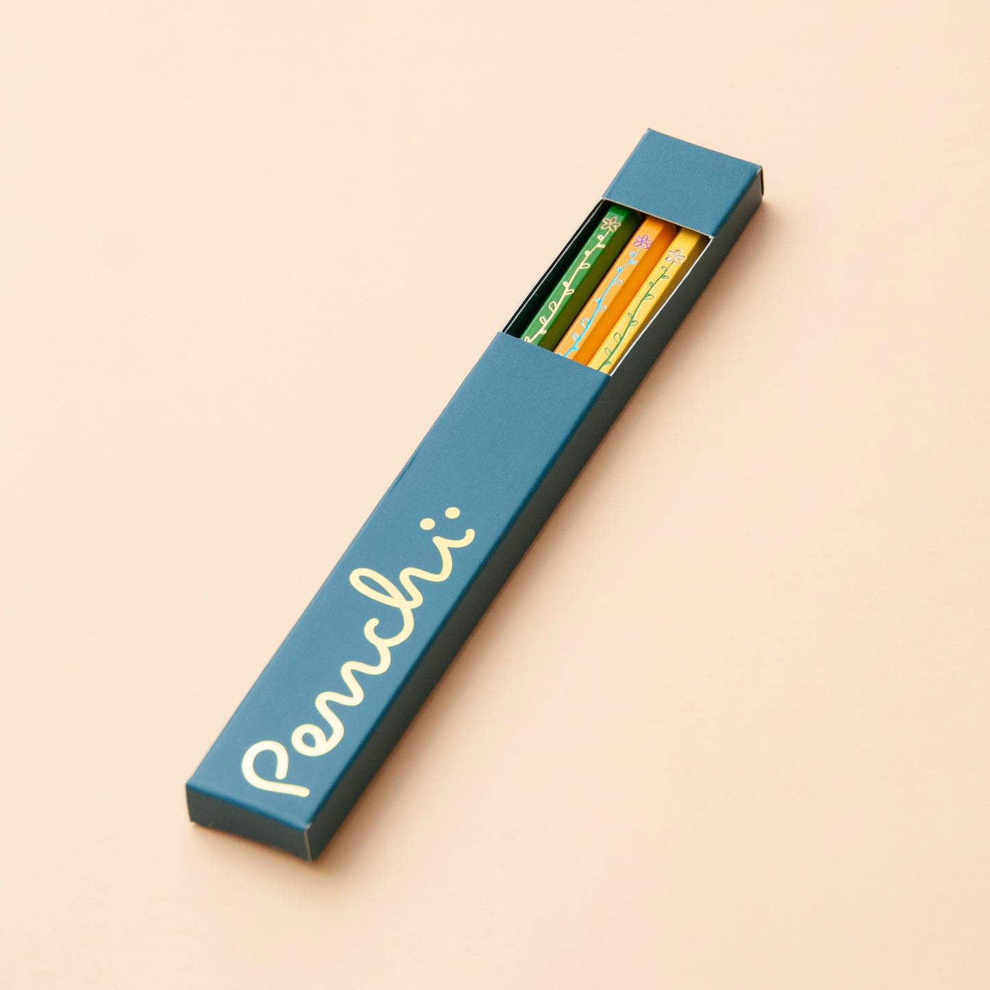 Metallic hot-foil stamped pencils with long floral design, packaged in branded box with window