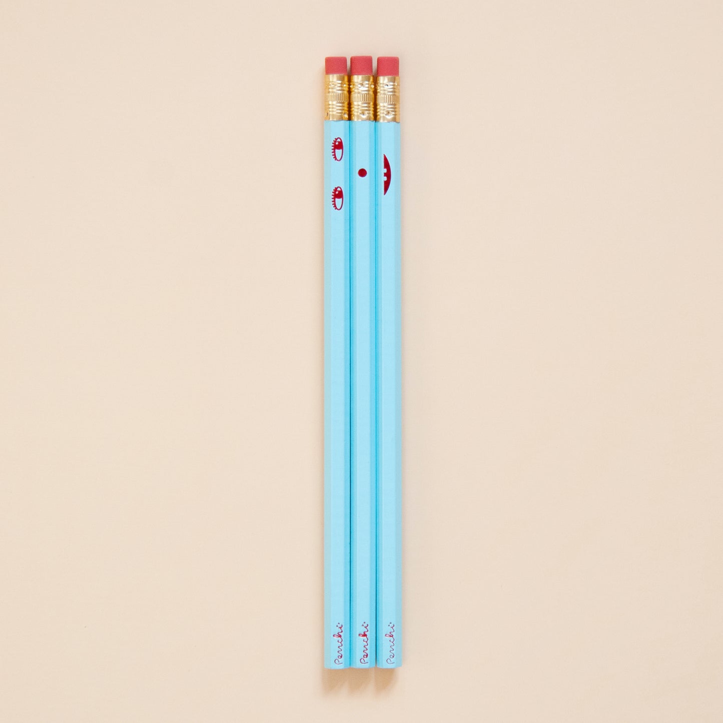 Creative face pencil set. Happy on the front and sad on the back. Hand-stamped using metallic hot-foils on wooden hexagonal pencils, light blue with red