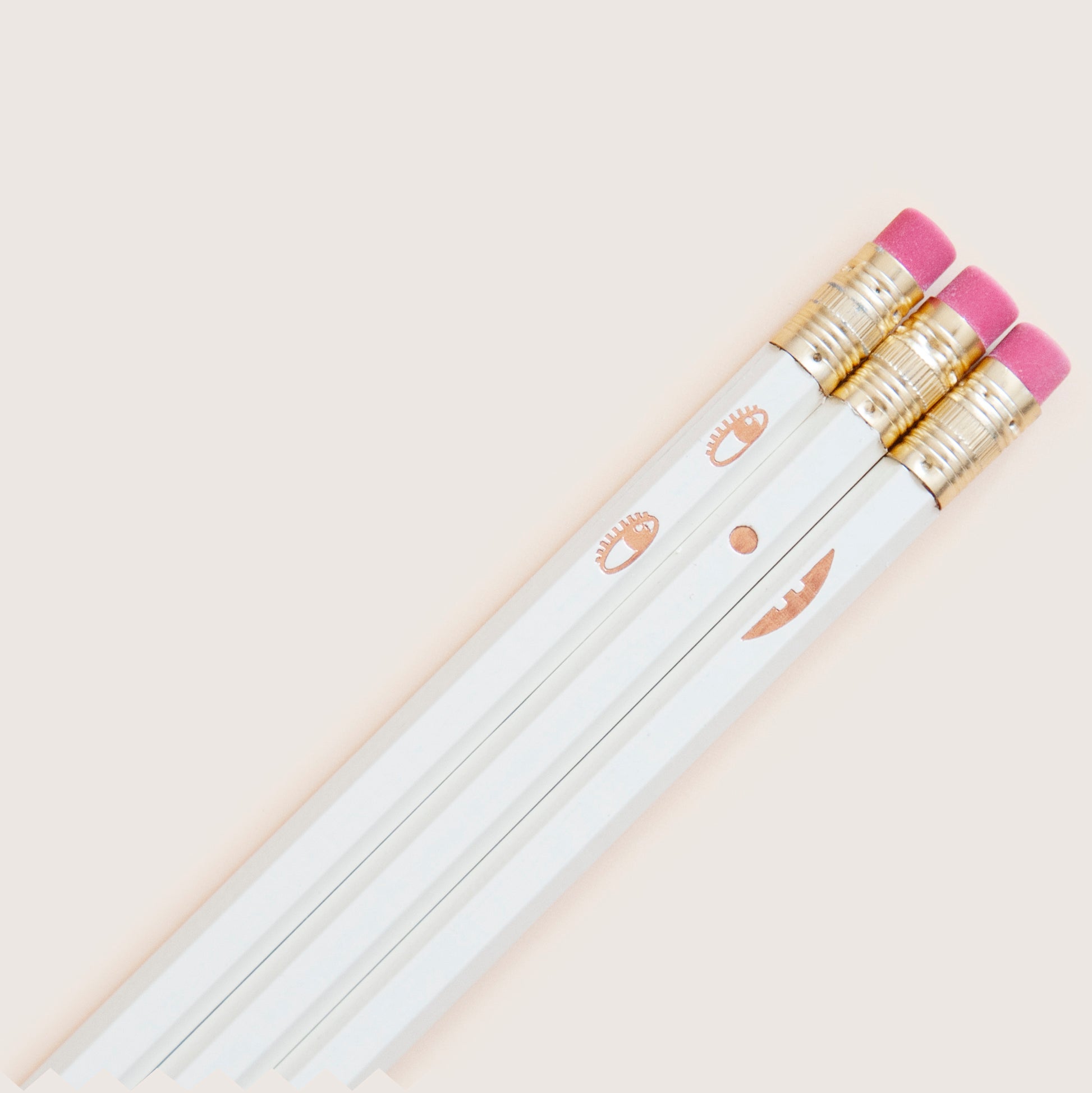 Creative face pencil set. Happy on the front and sad on the back. Hand-stamped using metallic hot-foils on wooden hexagonal pencils