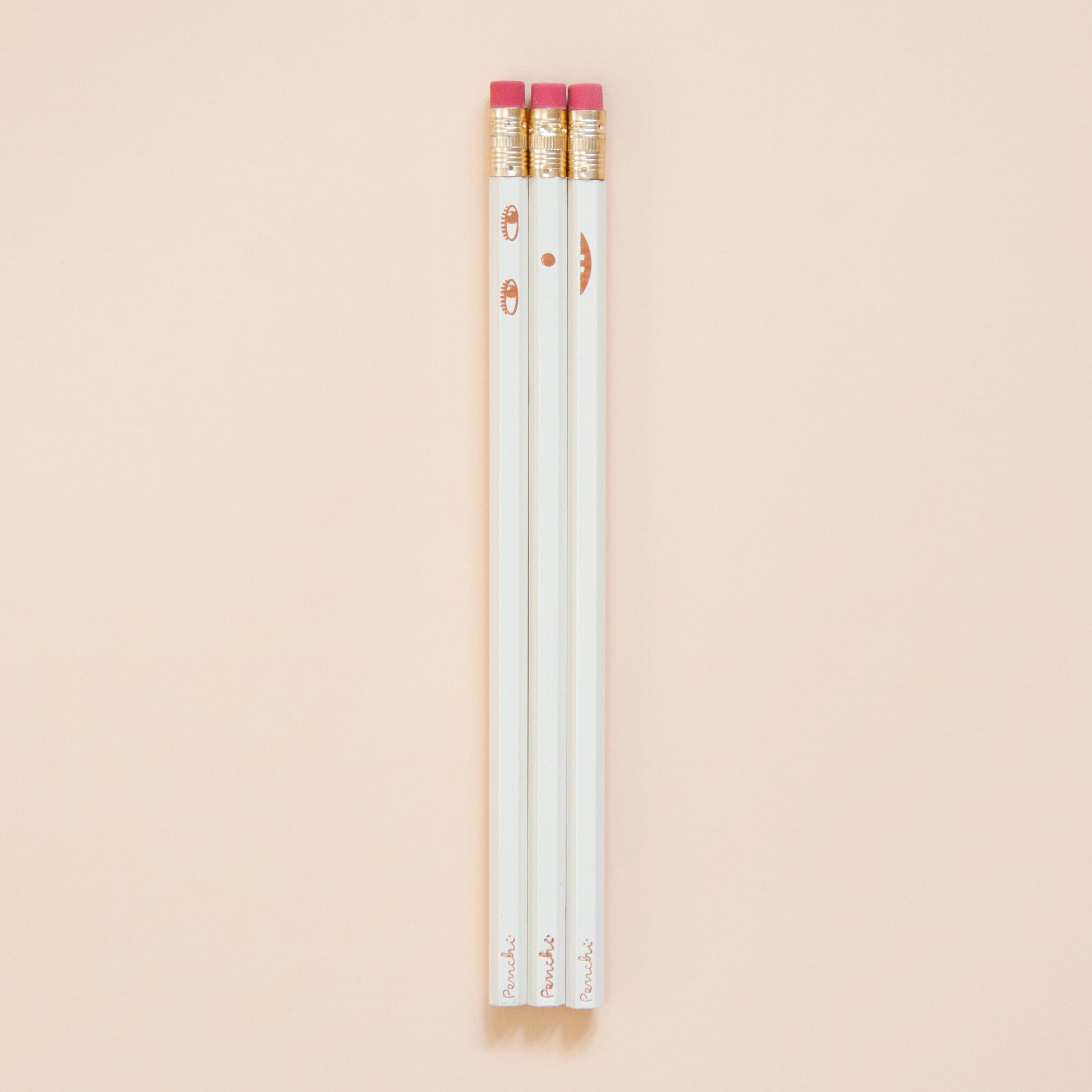 Creative face pencil set. Happy on the front and sad on the back. Hand-stamped using metallic hot-foils on wooden hexagonal pencils, ivory and copper