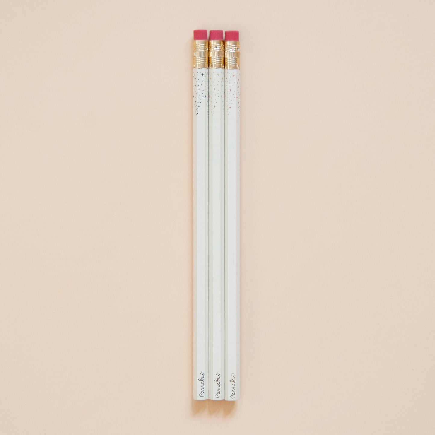 Neutral metallic shades of starry-tipped wooden pencils, hand-stamped in Toronto