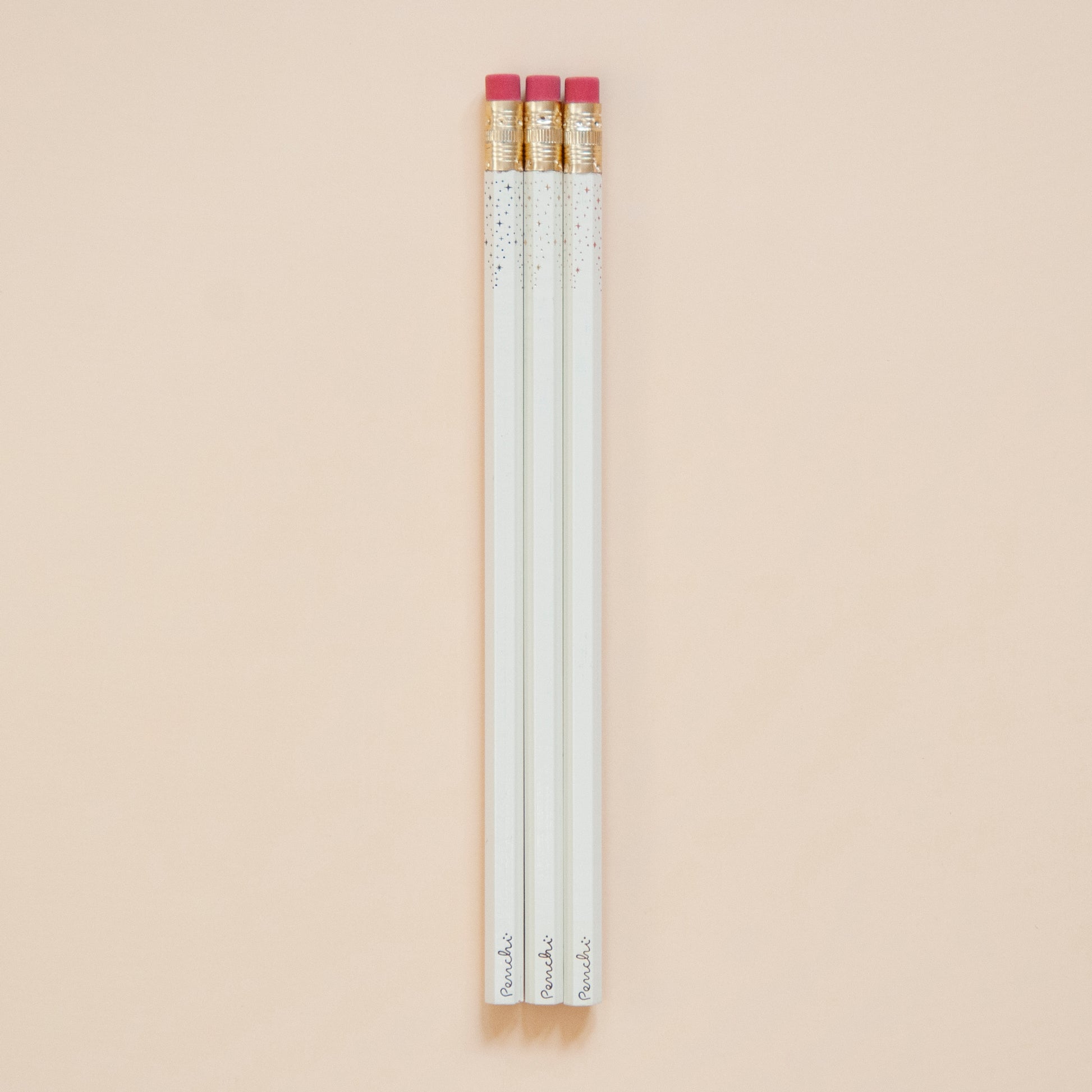 Neutral metallic shades of starry-tipped wooden pencils, hand-stamped in Toronto