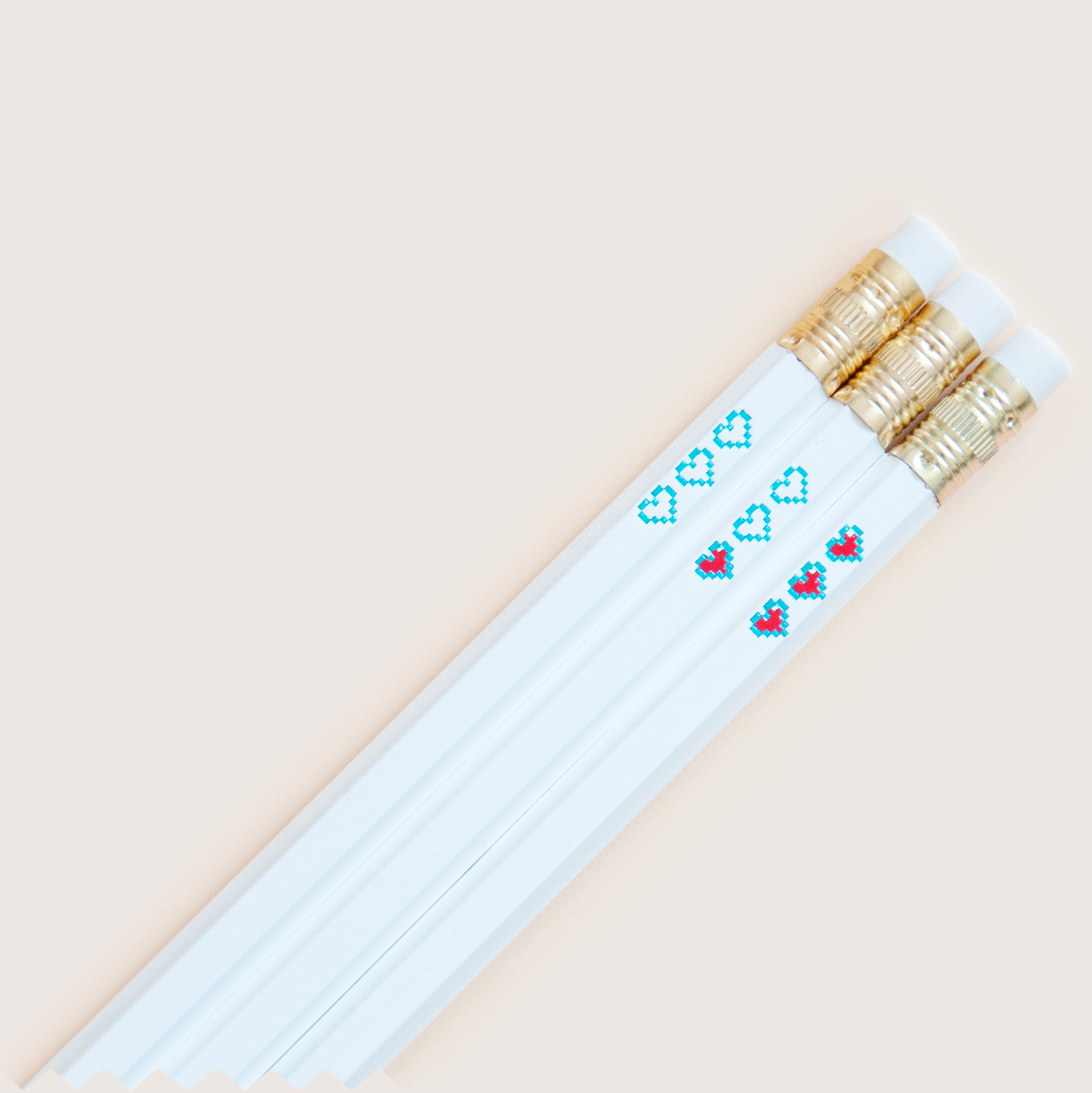 Hot foil-stamped pencil set with pixel heart containers, blue and red