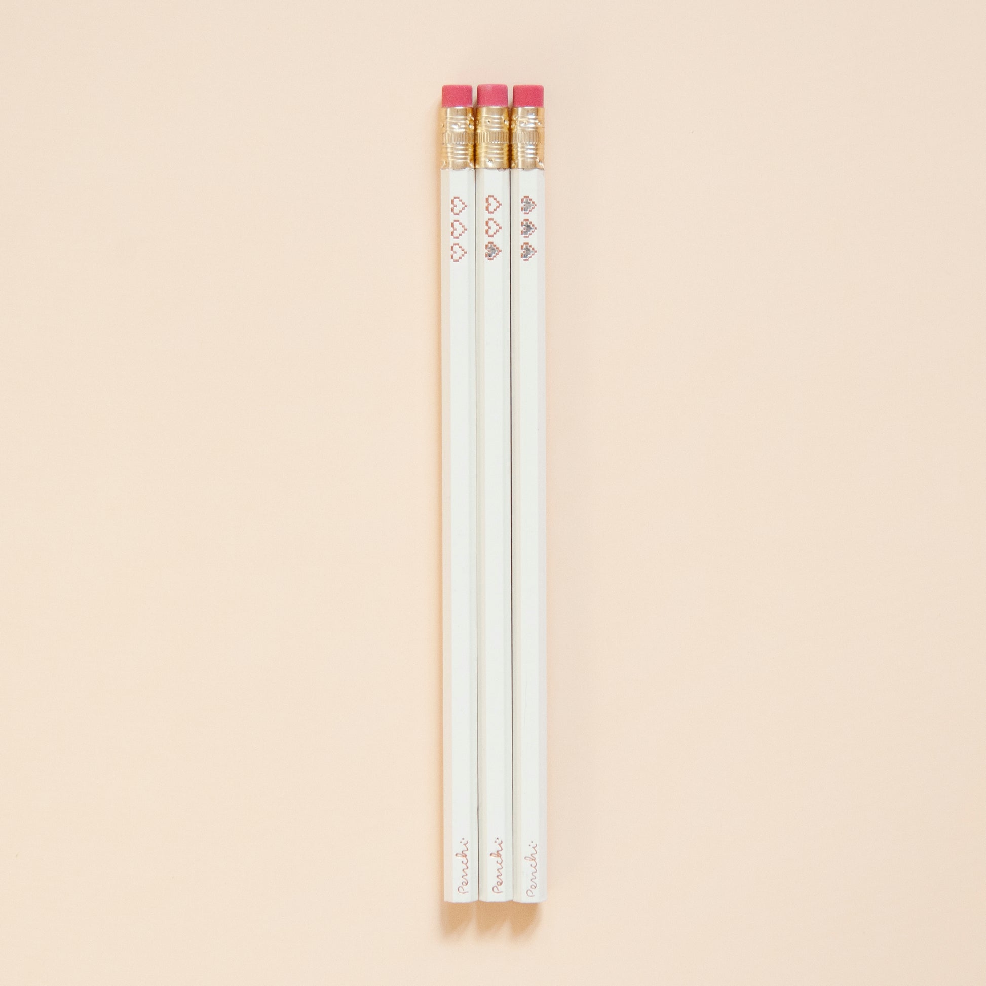 Hot foil-stamped pencil set with pixel heart containers, neutral tones, full scale