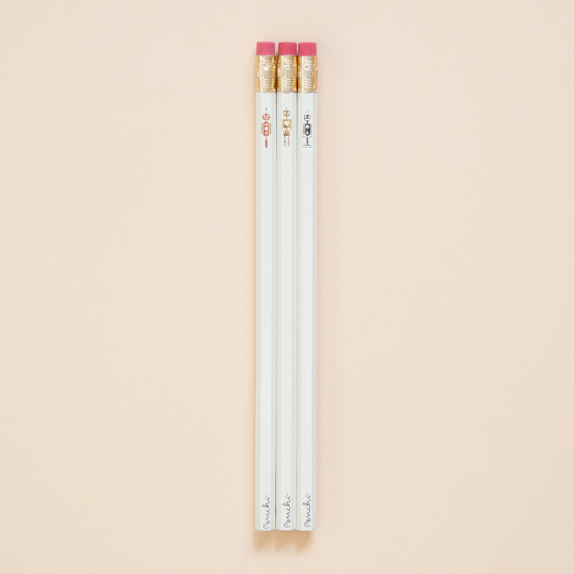 Full scale photo of robot pencil set, stamped by hand in Toronto using metallic hot foils, neutral shades