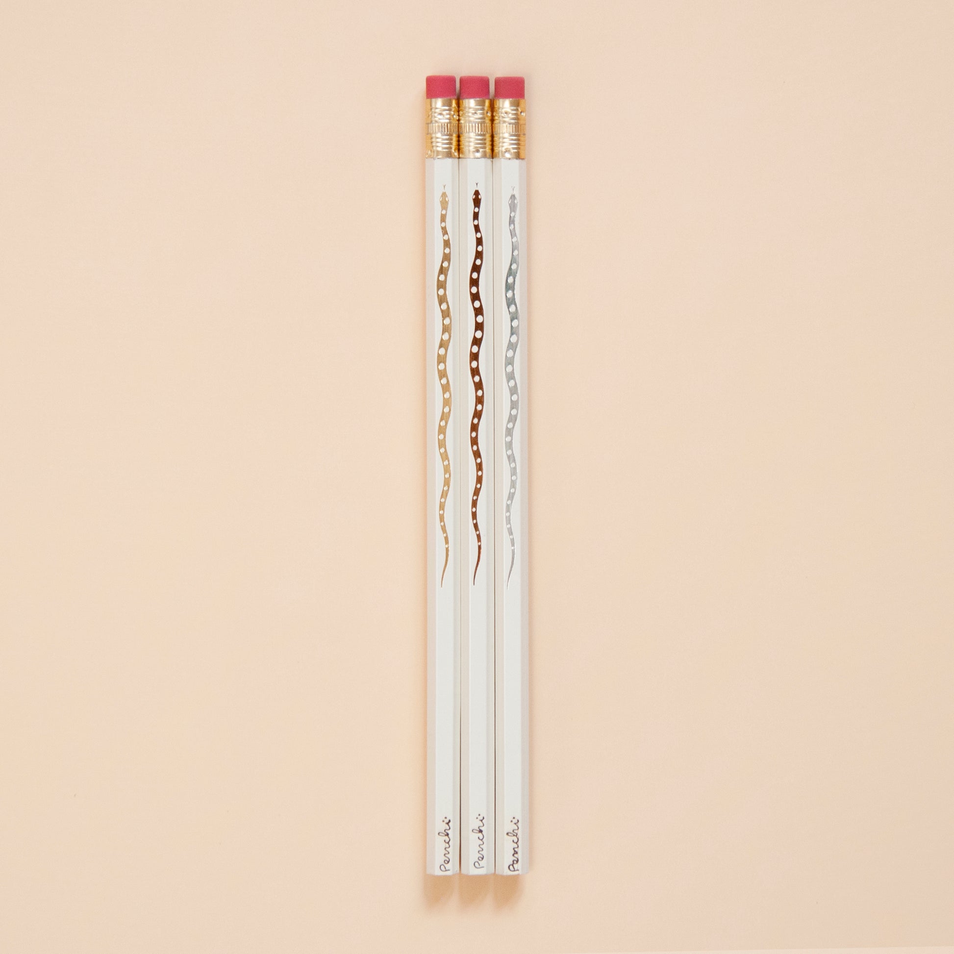 Hot foil-stamped snake pencil set full length, neutral metallic colors