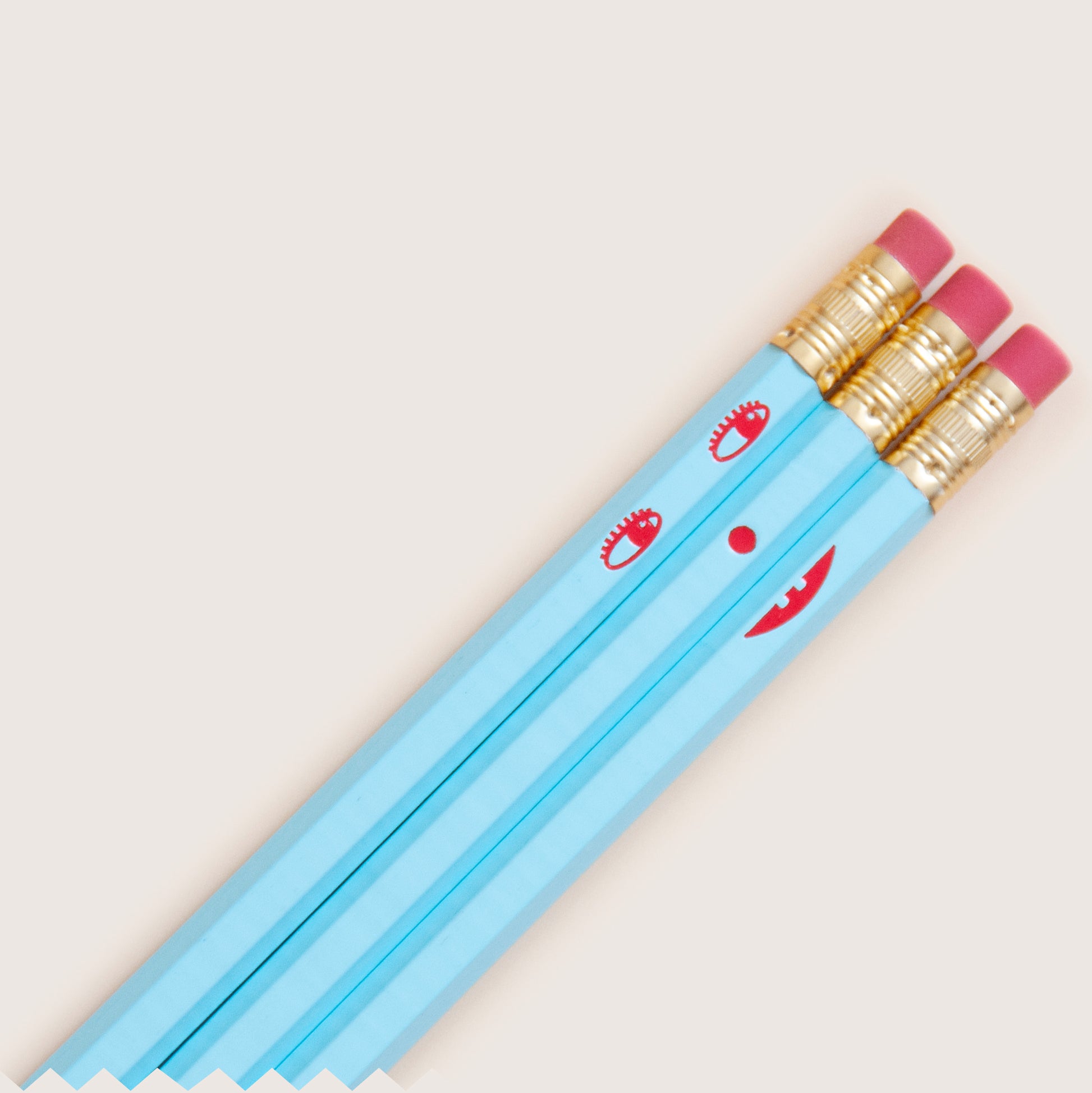 Creative smile face pencil set featuring both happy and sad face to mix and match, hand-stamped using hot-foils on wooden hexagonal pencils