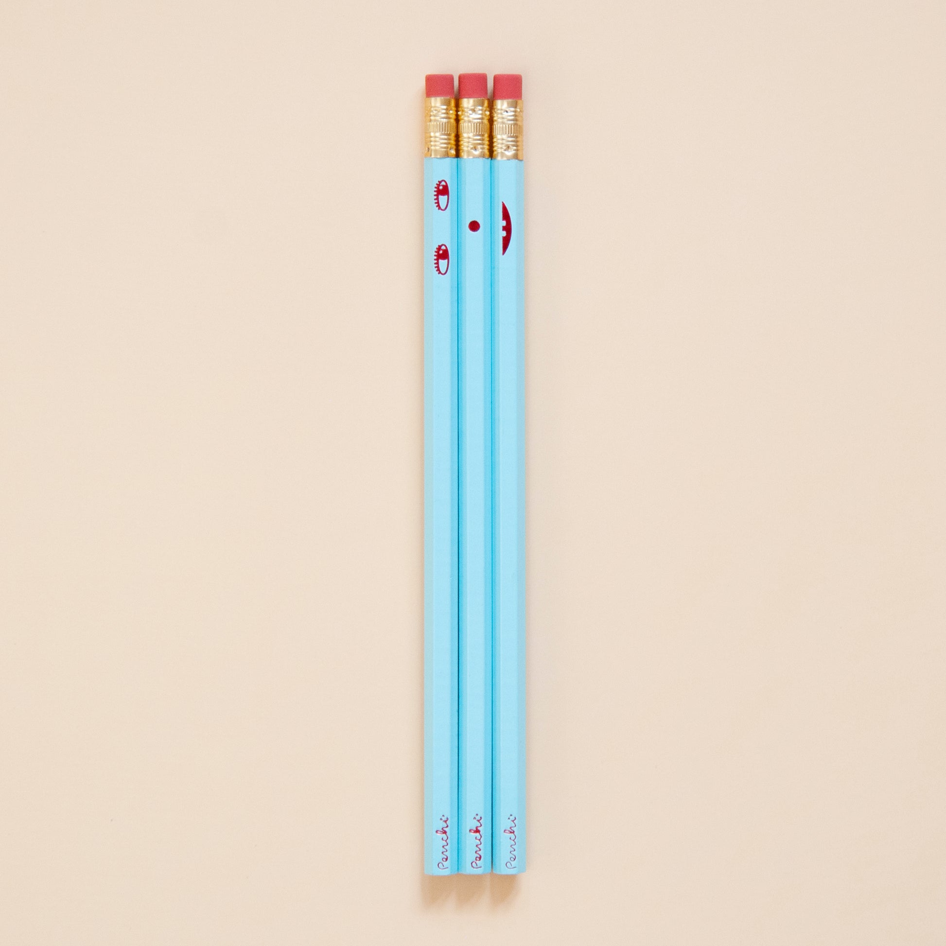 Creative face pencil set. Happy on the front and sad on the back. Hand-stamped using metallic hot-foils on wooden hexagonal pencils, light blue with red