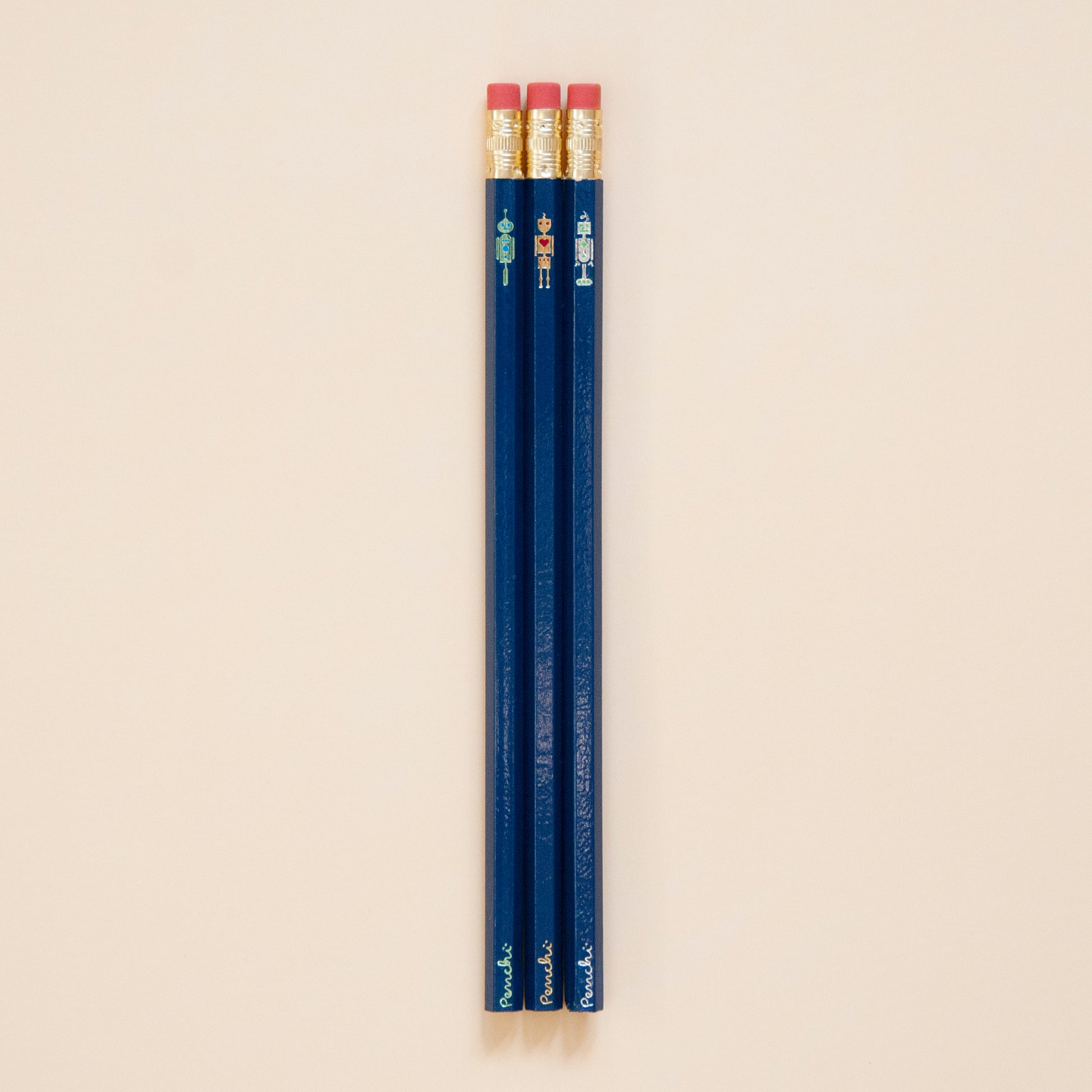 Full scale photo of robot pencil set, stamped by hand in Toronto using metallic hot foils, dark blue pencil base