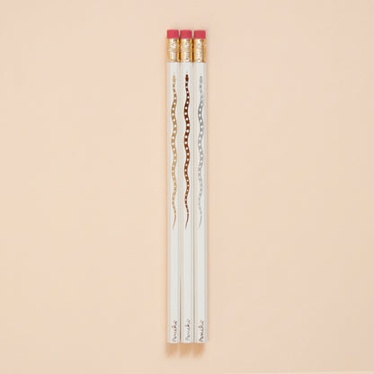 Hot foil-stamped snake pencil set full length, neutral metallic colors